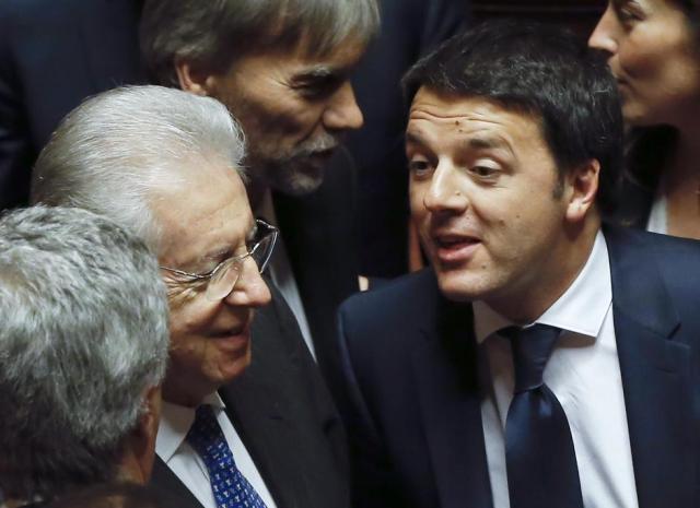 Italy's Prime Minister Renzi talks with his former counterpart Monti during a confidence vote at the Senate in Rome